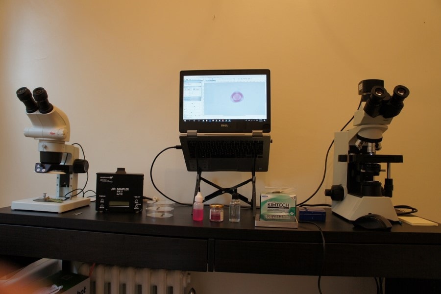 microscopes, camera, laptop, and an air sampler.